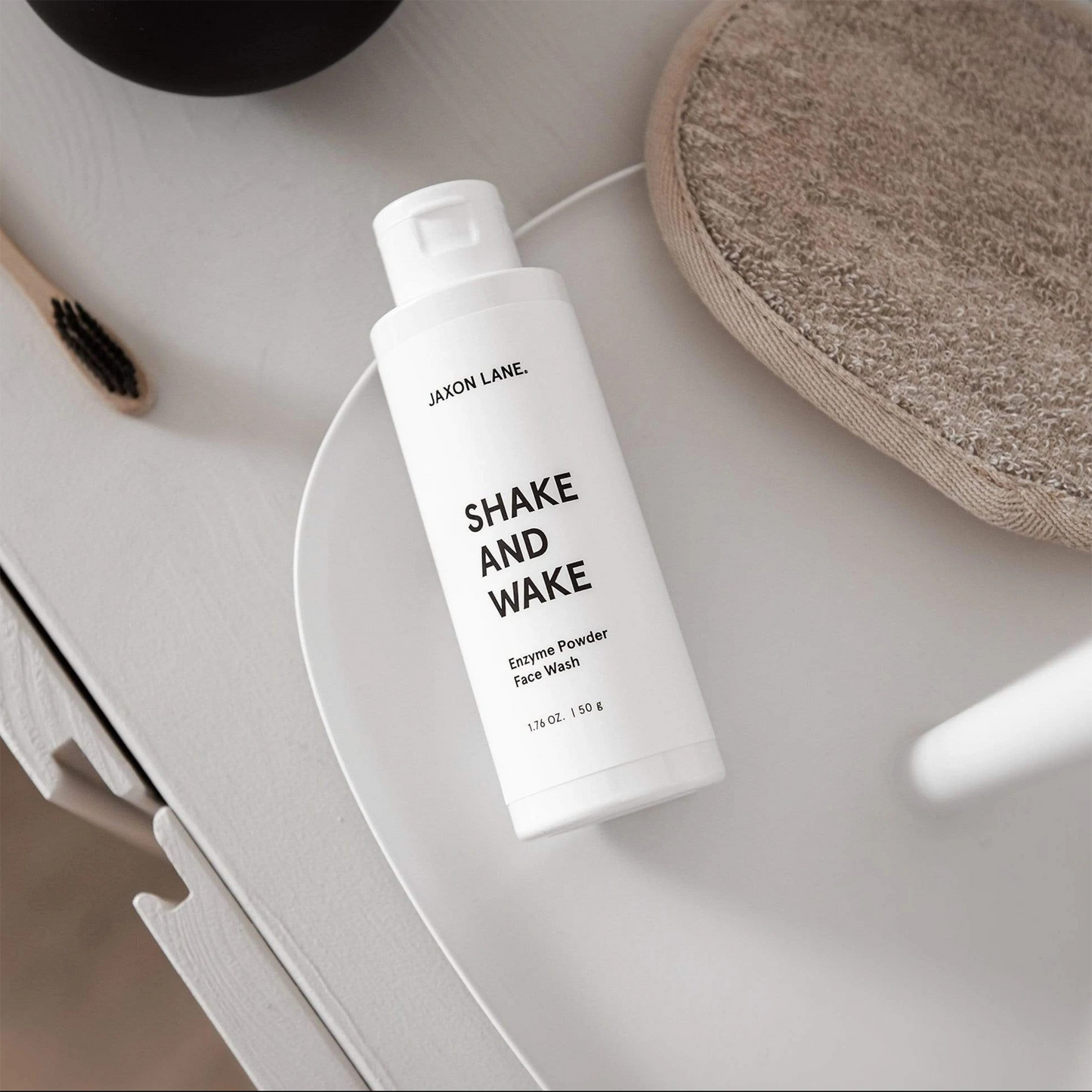 Jaxon Lane Shake And Wake Exfoliating Enzyme Powder Cleanser: Activated with water, our award winning face wash lathers into a silky foam that gently cleans and exfoliates for smooth, soft, healthy skin.