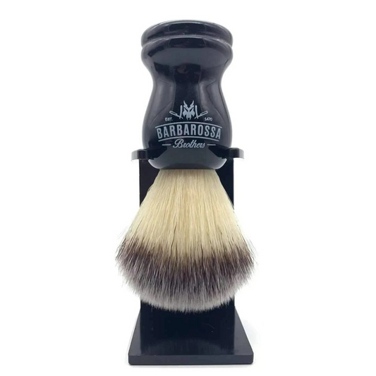 Barbarossa Brothers Premium Synthetic Silvertip Shaving Brush in Black: Developed with cutting edge precision and the finest materials, our synthetic shaving brush is designed to replicate the softness of silvertip badger hair whilst being animal friendly. Super soft at the tip and firm at the base, our vegan brush offers the best of both worlds. The artificial fibres are dyed to match the natural variation of badger hair providing a realistic, classical look that will last the test of time.